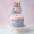 Daisy and Minnie cake topper on celebration cake