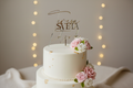 Topper inserted deeper into cake